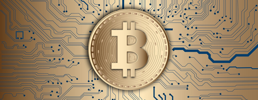 A Bitcoin on top of a circuit board
